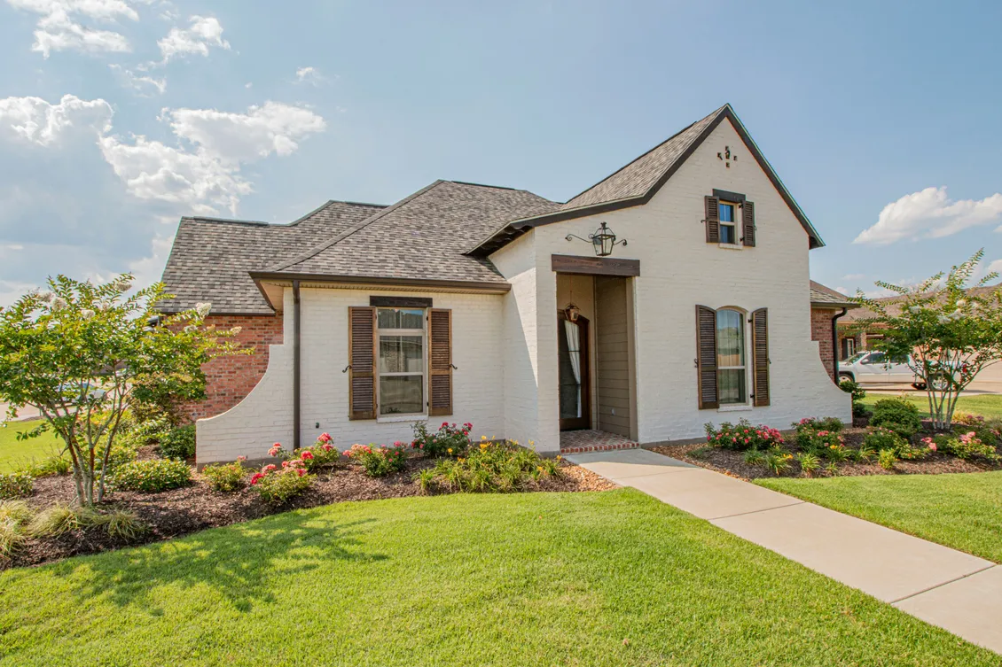 A well-kept single-storey home with a manicured front lawn