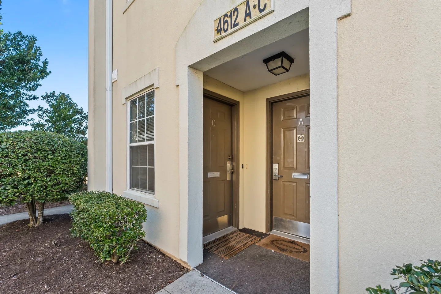Exterior entryway to units A and C labeled with building number 4612 under a covered alcove.