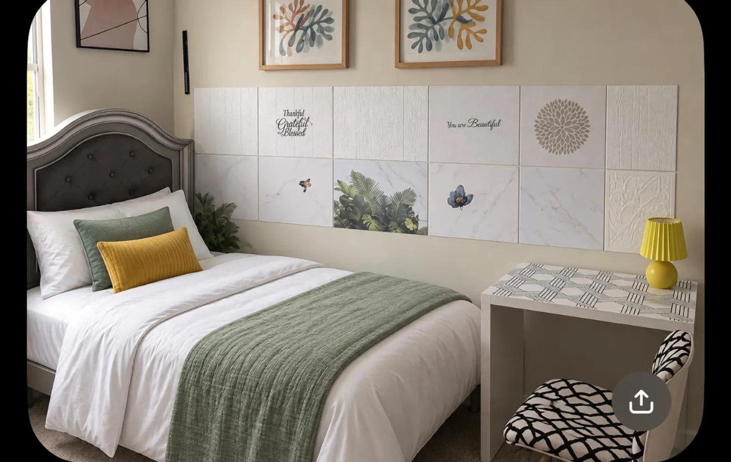 Bedroom with a single bed featuring an upholstered headboard, decorative wall tiles, and a small desk with a lamp.
