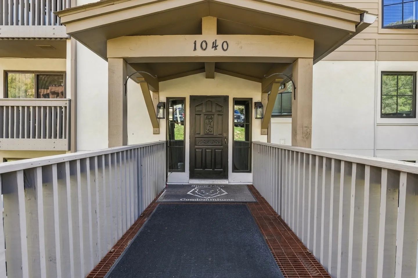 Exterior walkway leading to a covered entrance of a building labeled 1040.